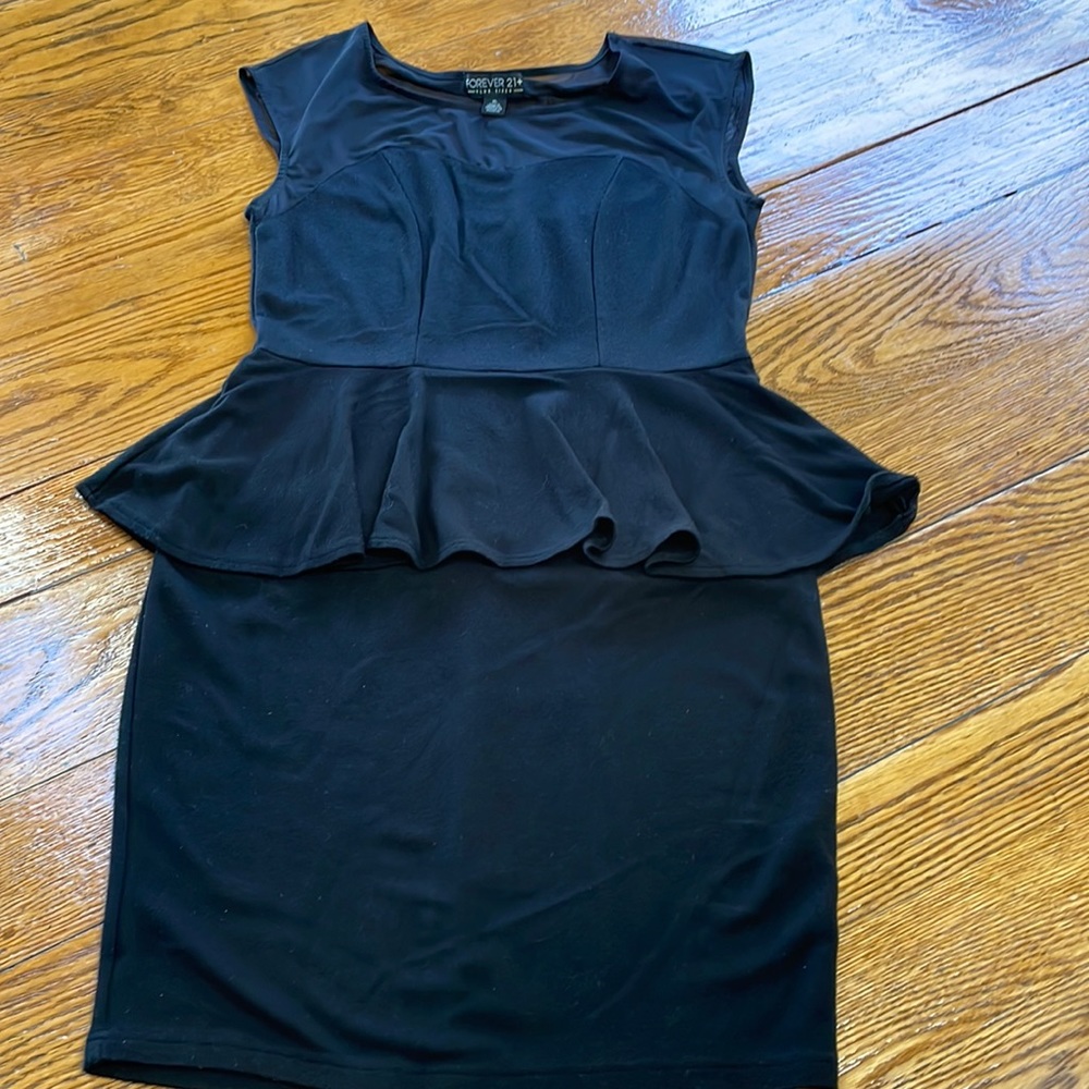 Forever 21 + basic black peplum style dress. Size XL. Good condition.
